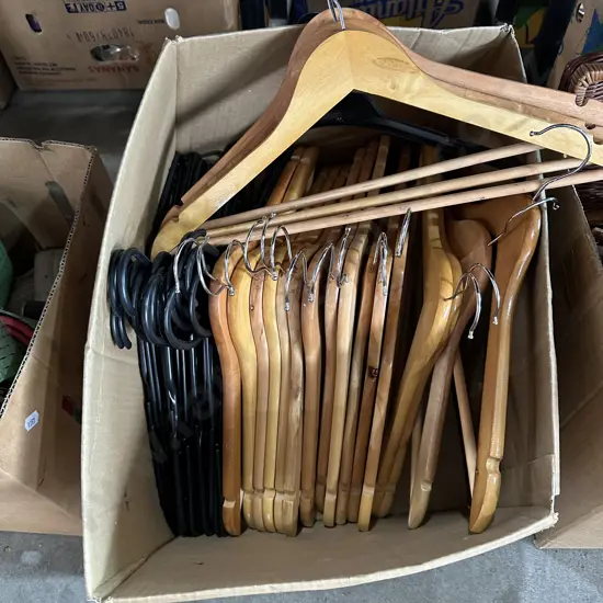 Box of 19 wooden coat hangers and others.