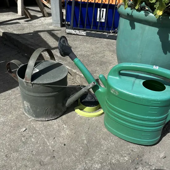 Watering cans and sprinkler.