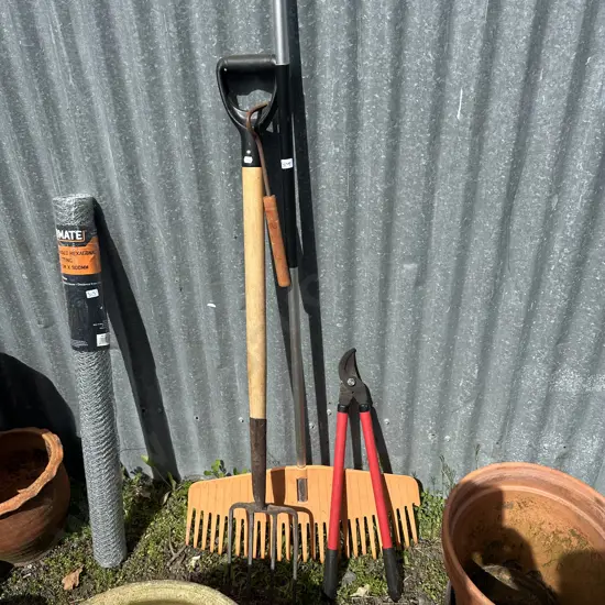 long handle fork, rake, loppers and small tool handle