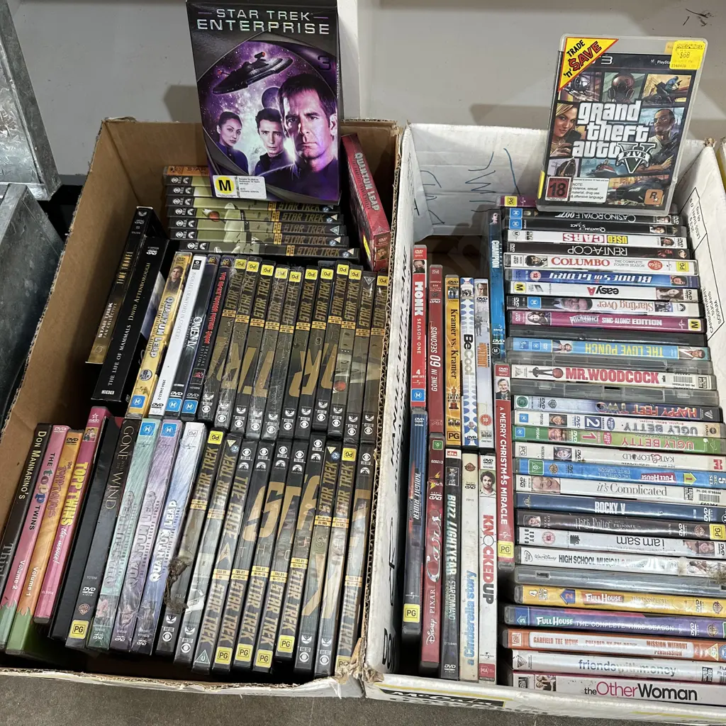 Two boxes of DVDs. Image 1++
