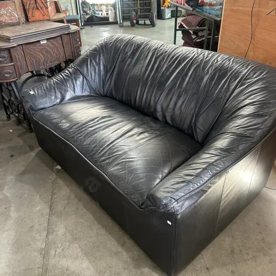 Black 2 seater sofa.