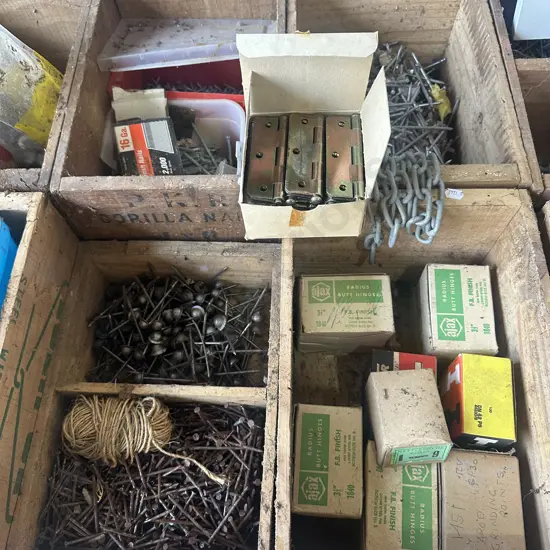 Four nail boxes with nails, screws and hinges etc.