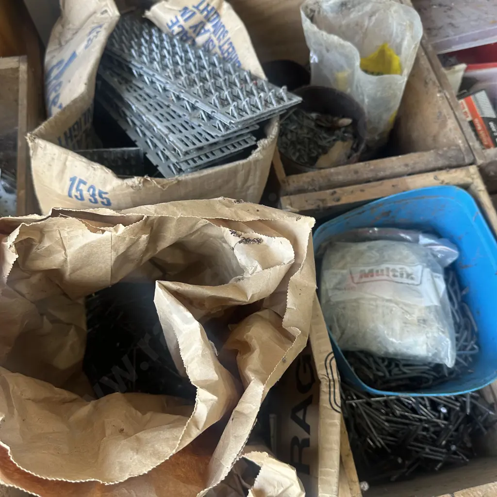 Two nail boxes with nails, staples and bolts plus two boxes with large nail plates etc. Image 1++