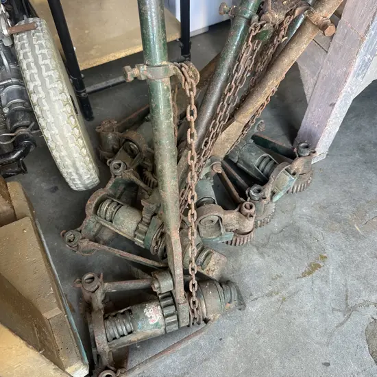 Five vintage flooring jacks.
