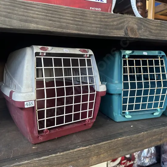 Two pet cages.