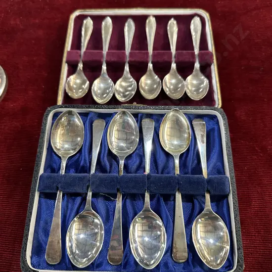 2 cased sets of Sterling spoons