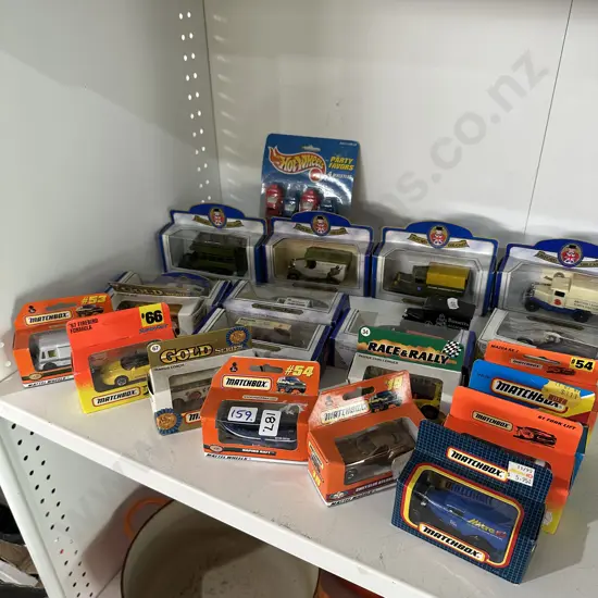 Collection of boxed toy cars and trucks.