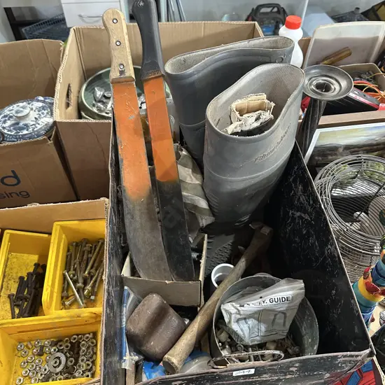 Metal bin with gumboots etc.