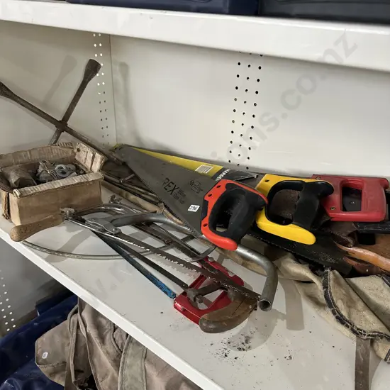 Shelf lot of saws, wheel brace, bolts etc.