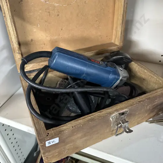 Ryobi angle grinder and storage box.
