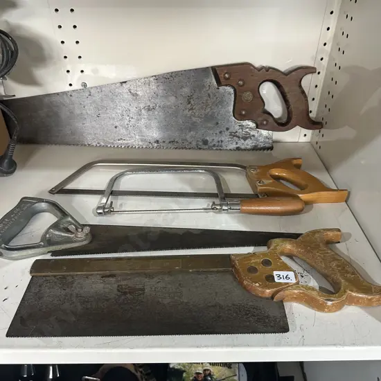 Shelf lot of saws.