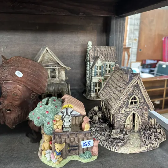 pottery houses and carved face