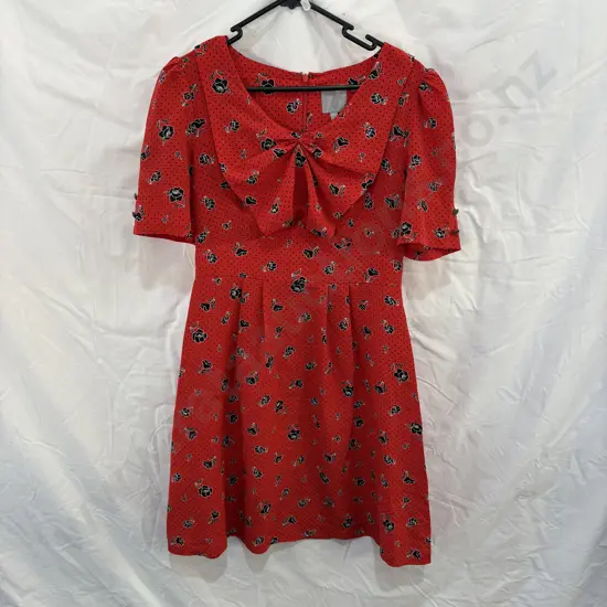 KAREN WALKER" hi there" mini dress with Peter Pan collar and bow tie (detail below)