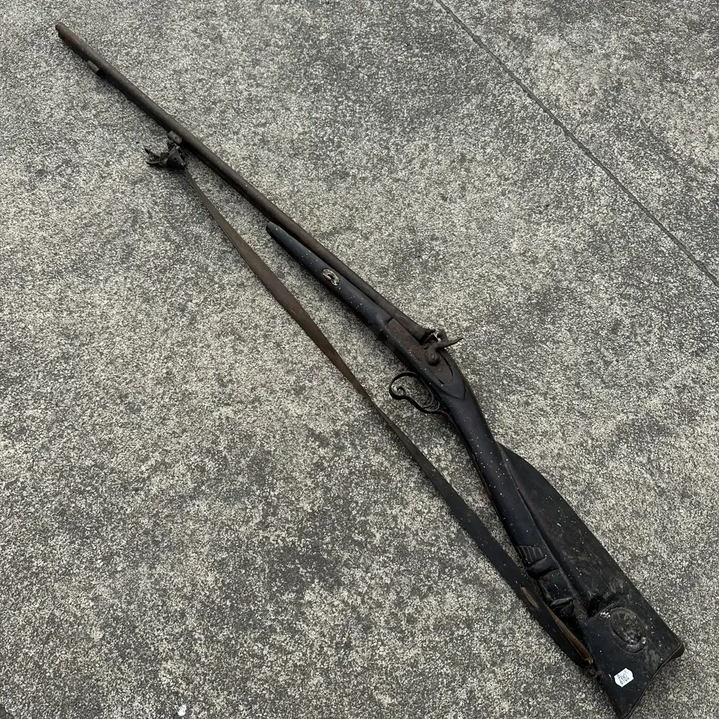 early African double flint action riffle with carved stock Image 1++