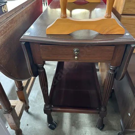 Drop leaf tea trolley with drawers both ends.