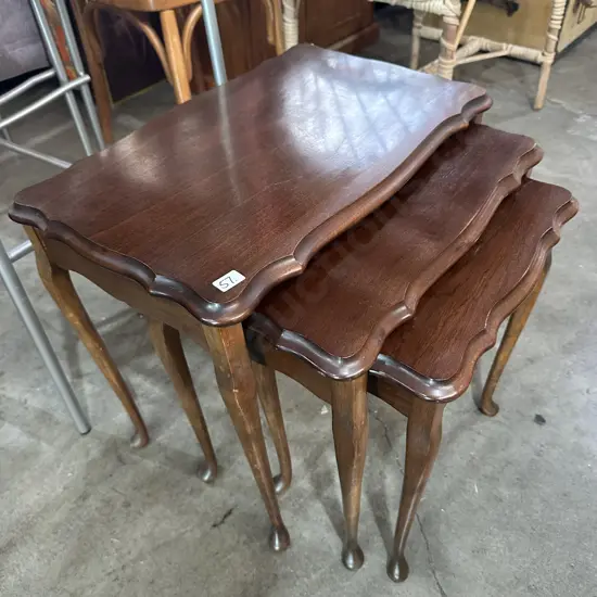 Nest of three solid timber tables.