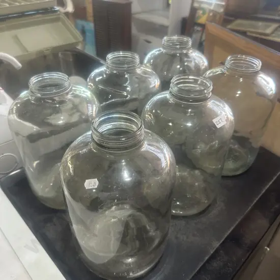 Six demijohn jars.