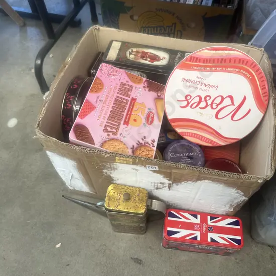 Box of assorted novelty tins.