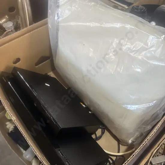 Two DVD players and furniture cover.