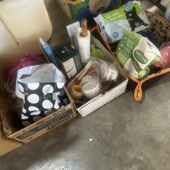 Three boxes wigs, dog bed and food etc.