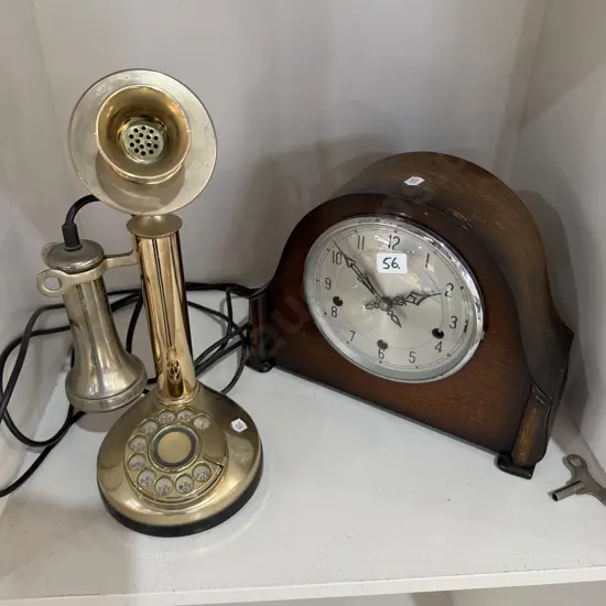 clock and candle stick phone