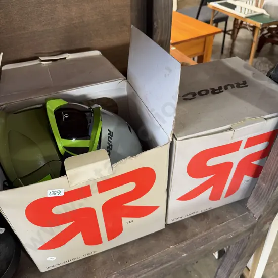 2 boxed helmets