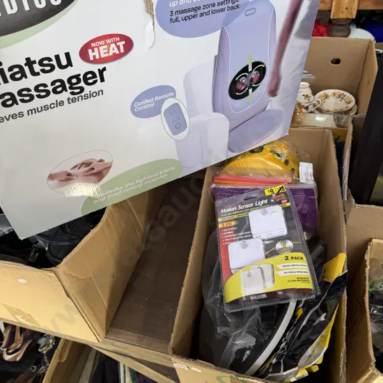 Box lot of new items plus massager.