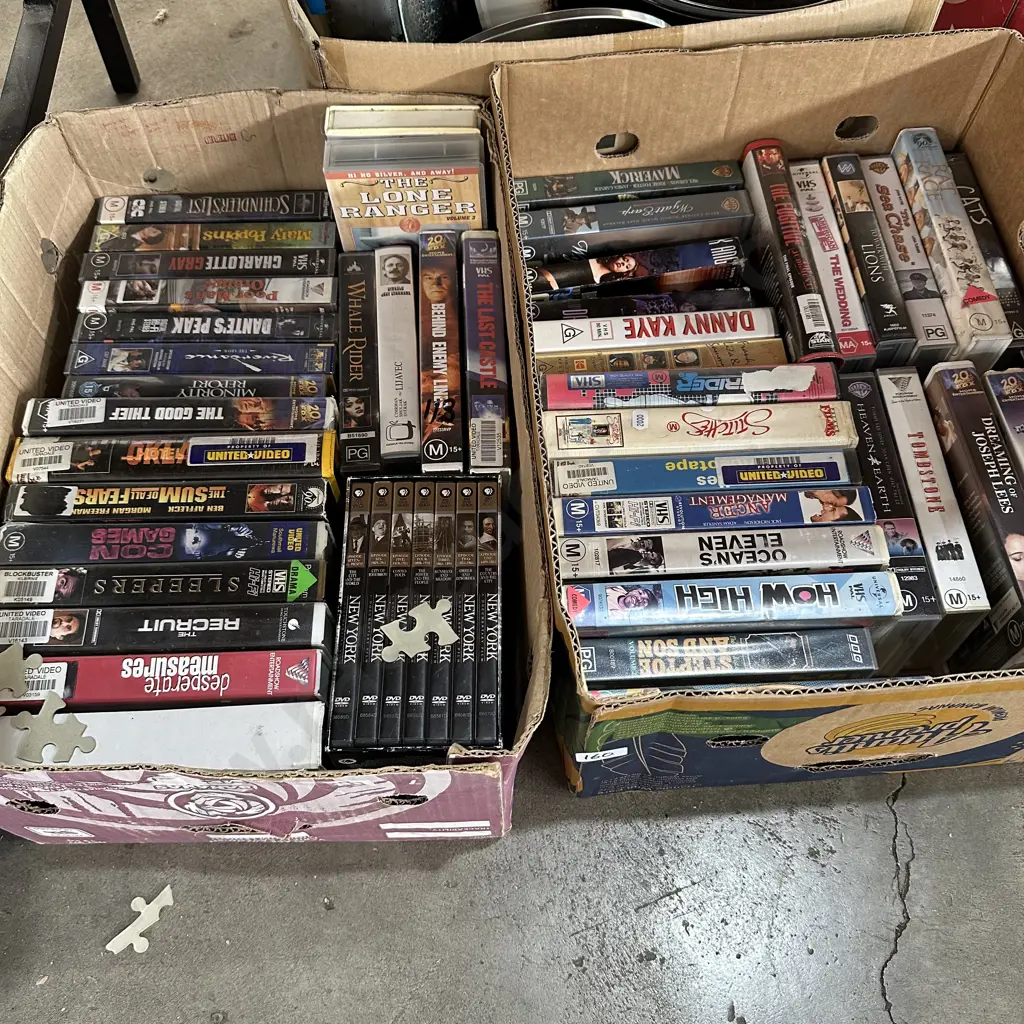 2 boxes DVDs and VHS tapes Image 1++