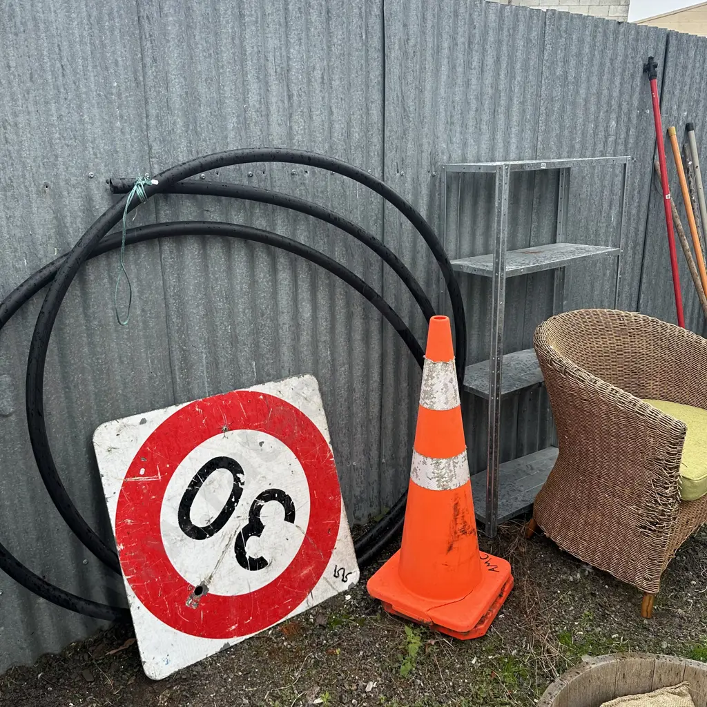 Wicker chair, pipe tube, cones, metal shelf and sign Image 1++