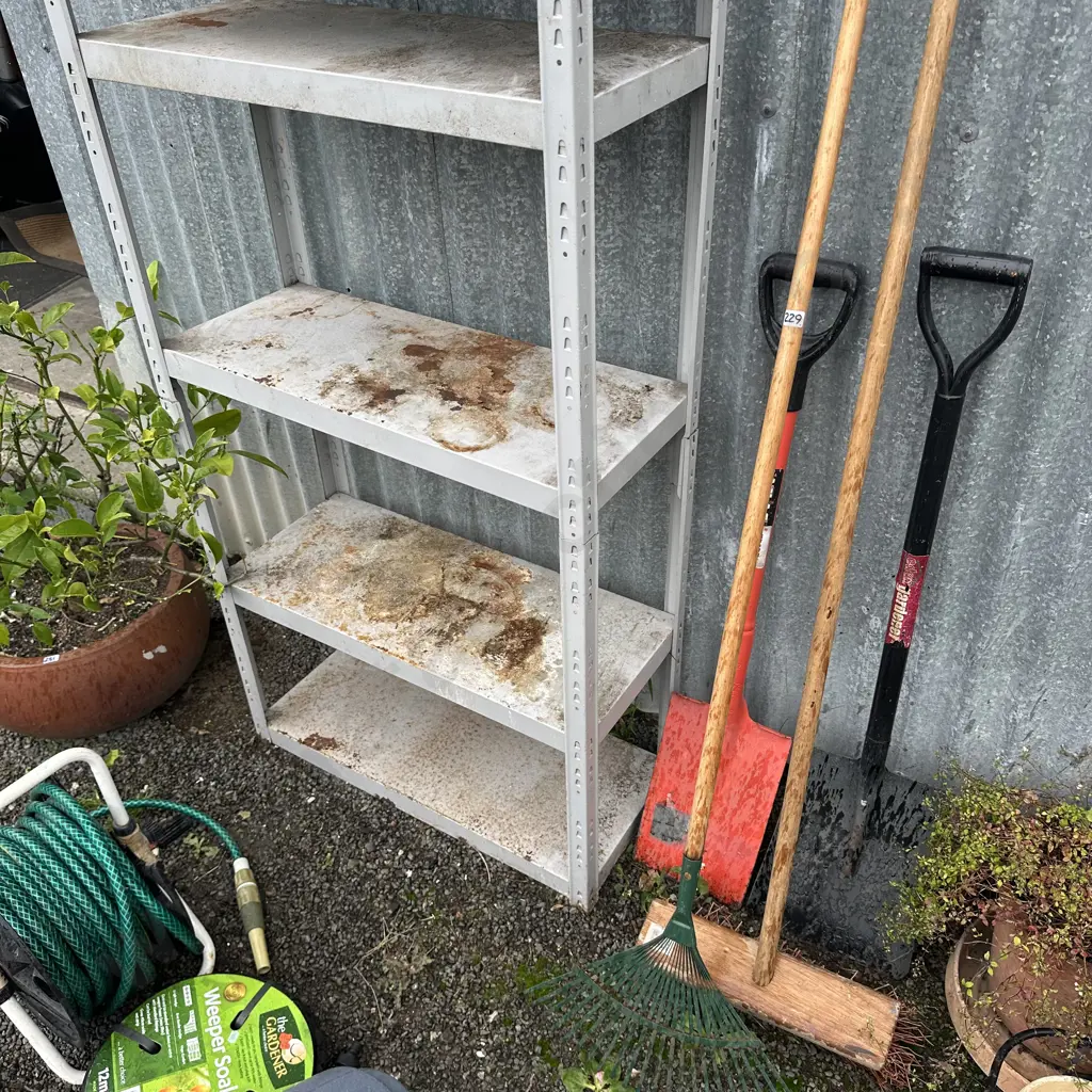 2 spades, broom and rake plus garage shelves Image 1++