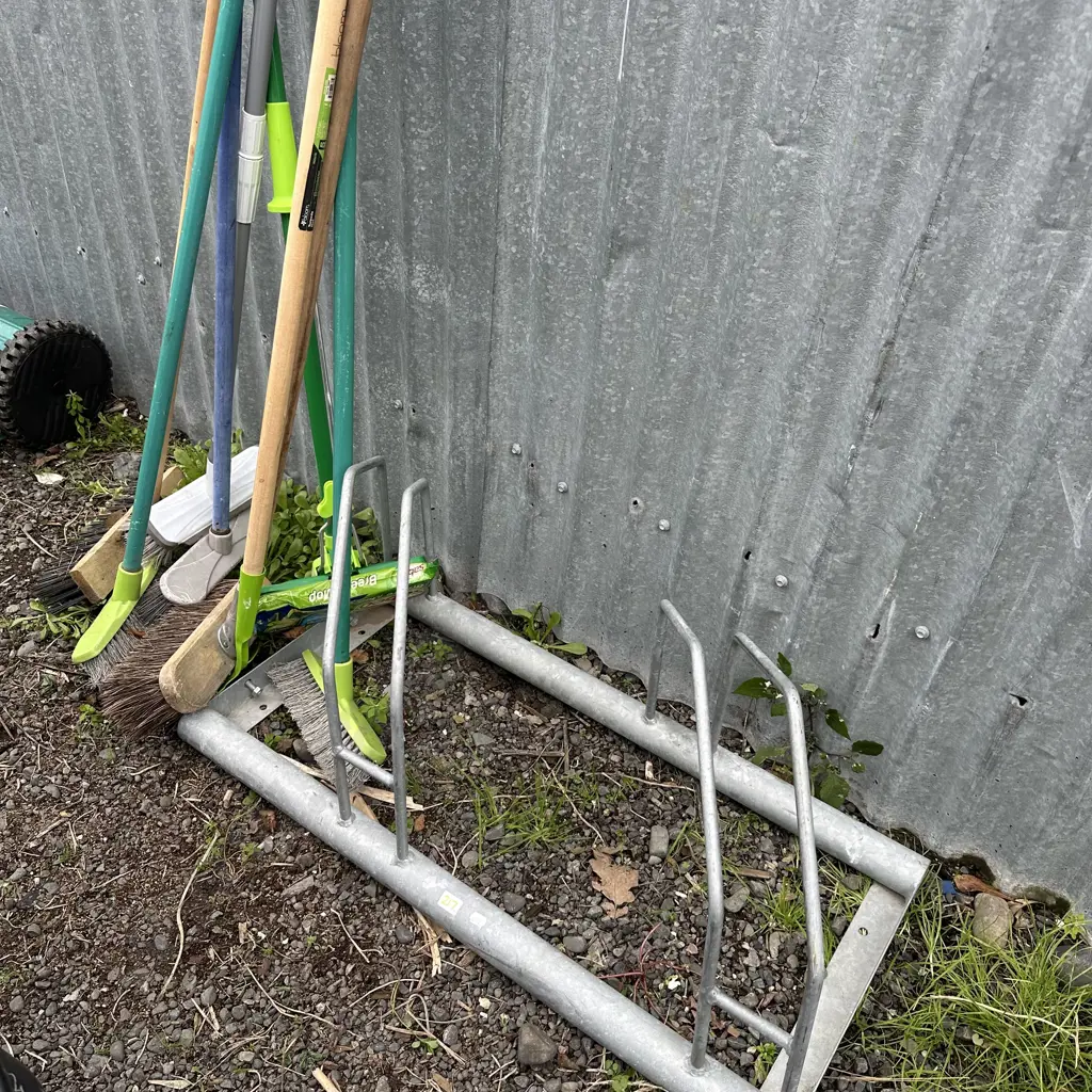 bike stand and brooms Image 1++