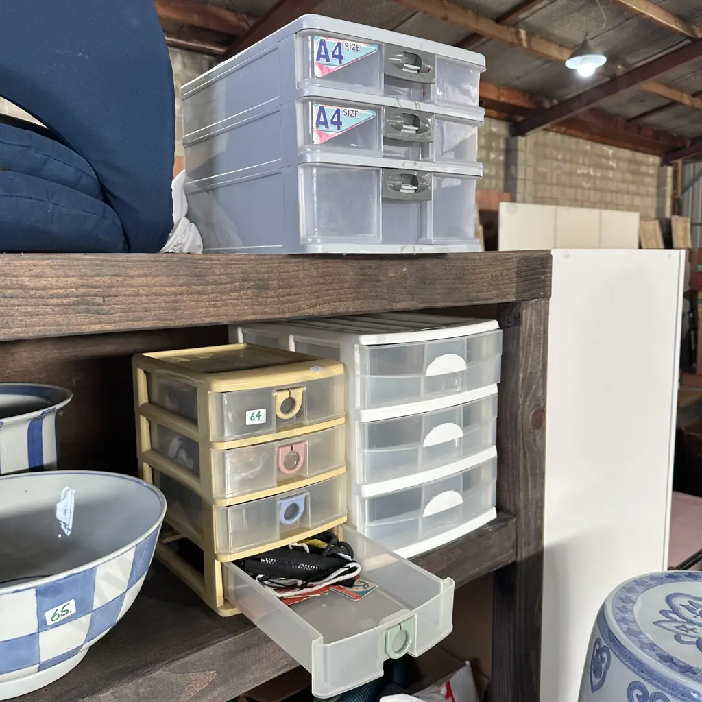 Three plastic drawers and contents Image 1++