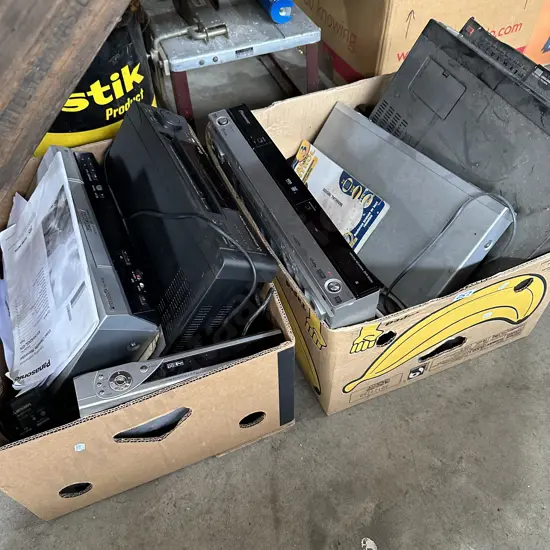 Two boxes,VCRs and DVDs ets