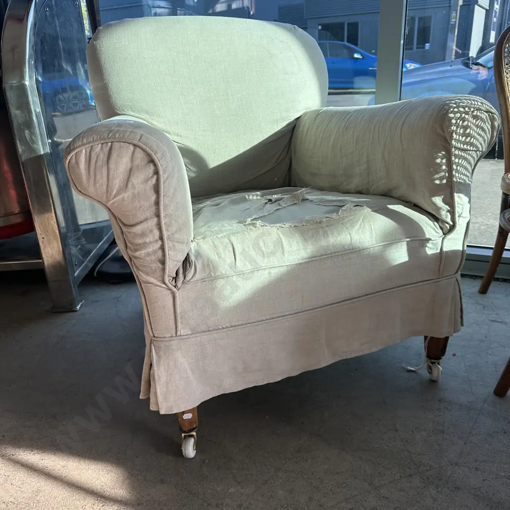 Vintage rolled arm lounge chair on porcelain casters Image 1++