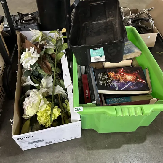 Bin of books plus plastic flowers