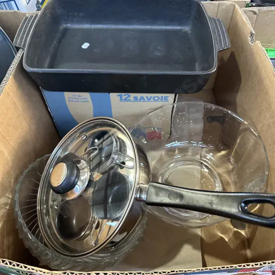 Two bowls, egg poacher, glasses and cast iron baking dish.