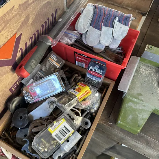 Six inch nails, new gloves and file, box of chain and hardware etc.