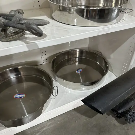 3 Stainless steel pans.
