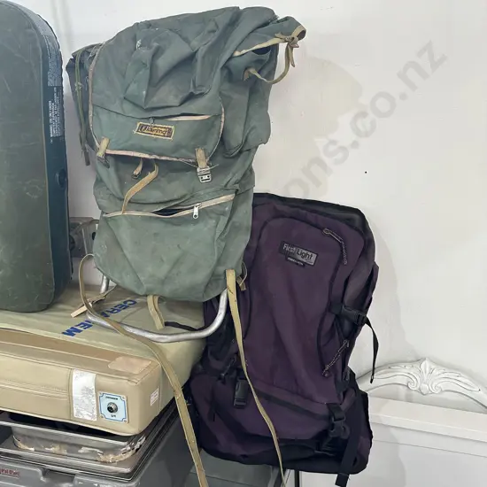 Two packs and bin of helmets etc.