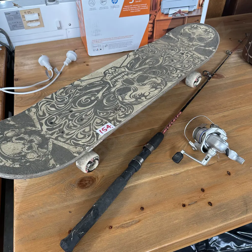 Skateboard and kids fishing rod and reel Image 1++