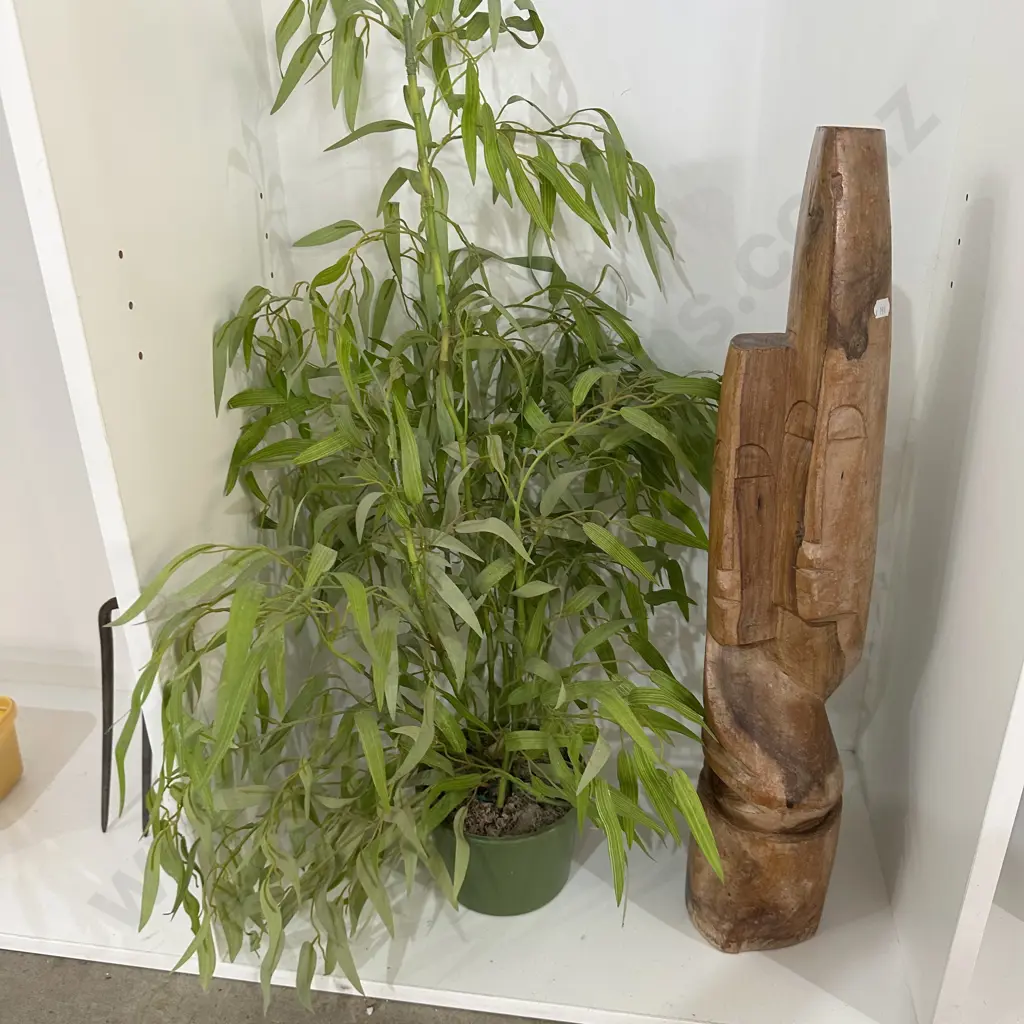 wooden carving and fake plant Image 1++