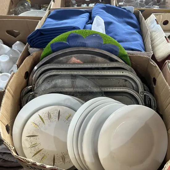Two boxes, Plates, serving trays, table cloths