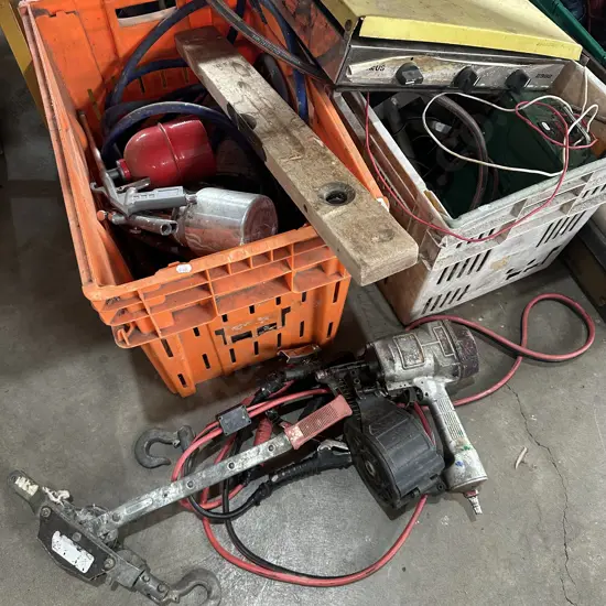 Two bins, air nail gun, winch, camp stove, spray paint gear etc.