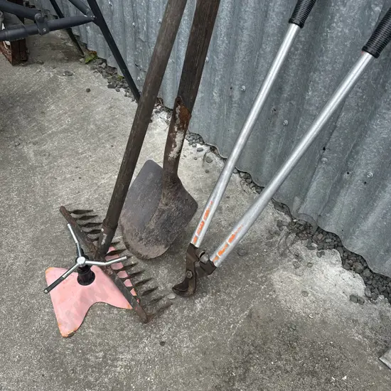 Shovel, rack, loppers, sprinkler