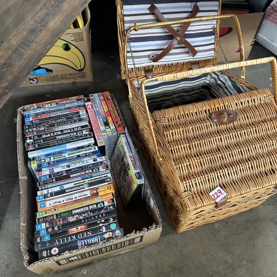 Box of DVDs and picnic basket.