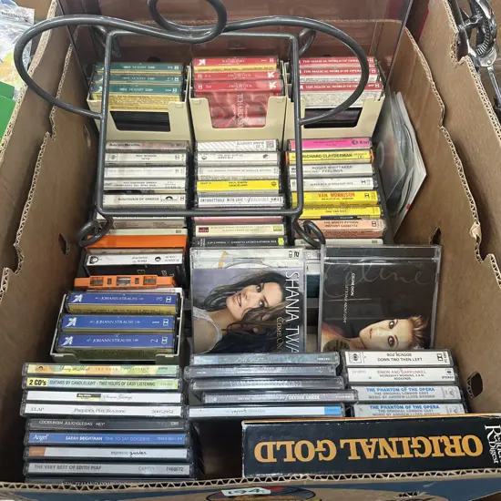 Cassettes, CDs and rack.