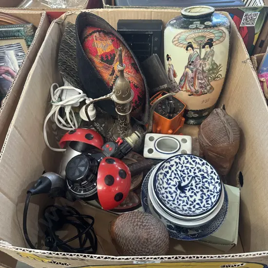 Carved heads, oriental vase, water timers etc.