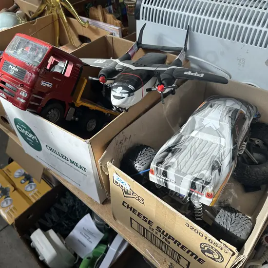 Two boxes toy trucks and plane etc.