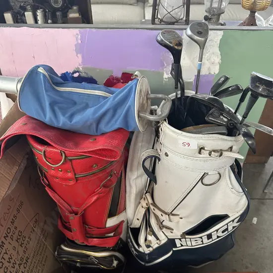 Two golf bags, clubs and ball collector plus art