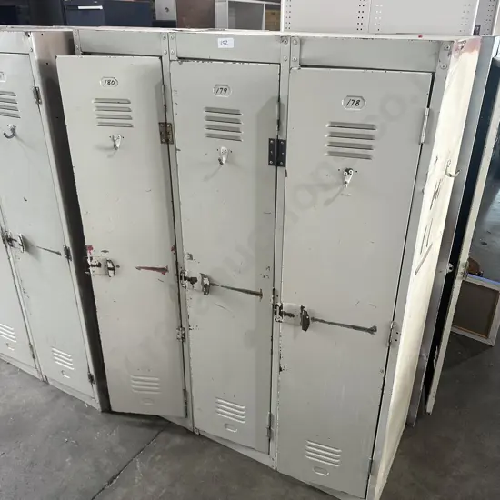 3 adjoined steel lockers (1 end open)
